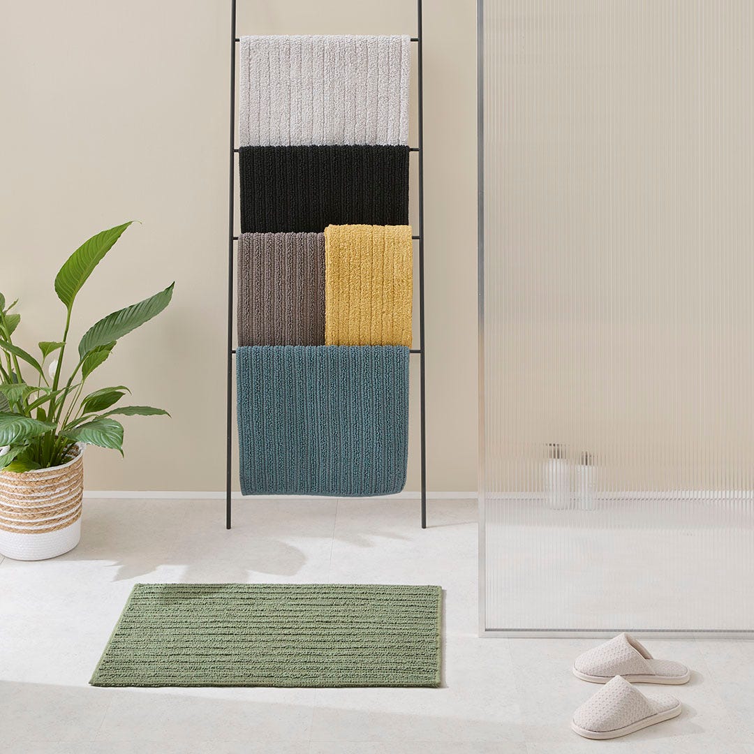 https://s3-ap-southeast-2.amazonaws.com/fusionfactory.commerceconnect.bbnt.production/pim_media/000/174/429/M_F_S24-25_Summer_LS_Studio_Bathmats-Devon_BM_Khaki_SI.jpg?1730098069