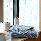 https://s3-ap-southeast-2.amazonaws.com/fusionfactory.commerceconnect.bbnt.production/pim_media/000/173/960/M_F_Summer_S24-25_LS_Location_Bathroom_Bath_Towel_BT_Franco_Soft_Blue_3.jpg?1729733503