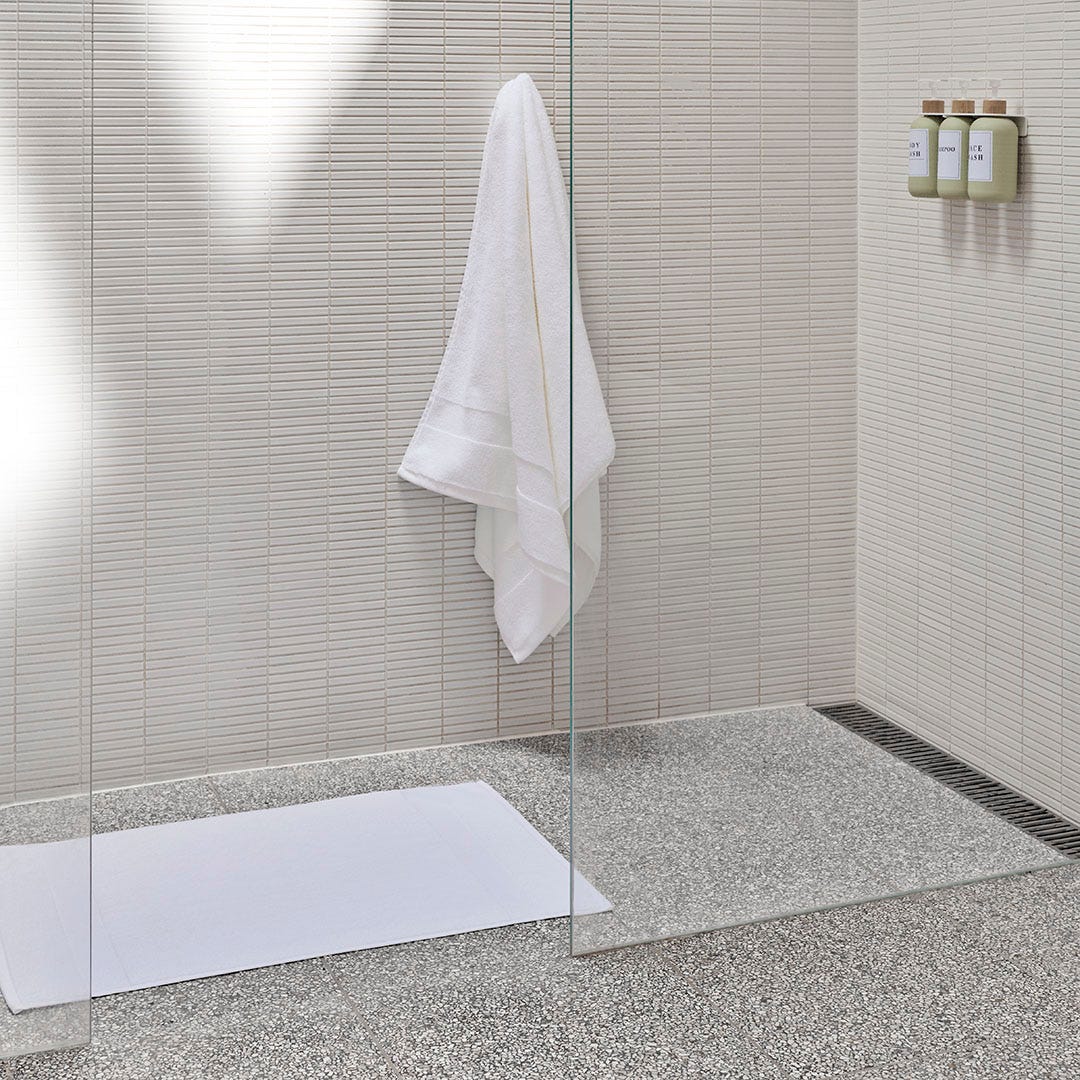 https://s3-ap-southeast-2.amazonaws.com/fusionfactory.commerceconnect.bbnt.production/pim_media/000/200/494/M_F_Summer_S25-26_LS_Bathroom_Towel_Bathmat-Ultra_Soft_White_SI.jpg?1757027816