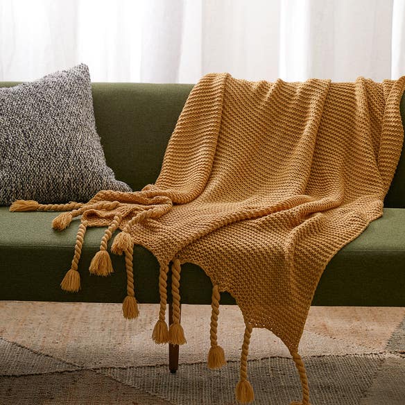 https://s3-ap-southeast-2.amazonaws.com/fusionfactory.commerceconnect.bbnt.production/pim_media/000/162/360/M_F_W24_LS_Throw_Blanket_Chunky_Tassel_Mustard_SI.jpg?1711504892